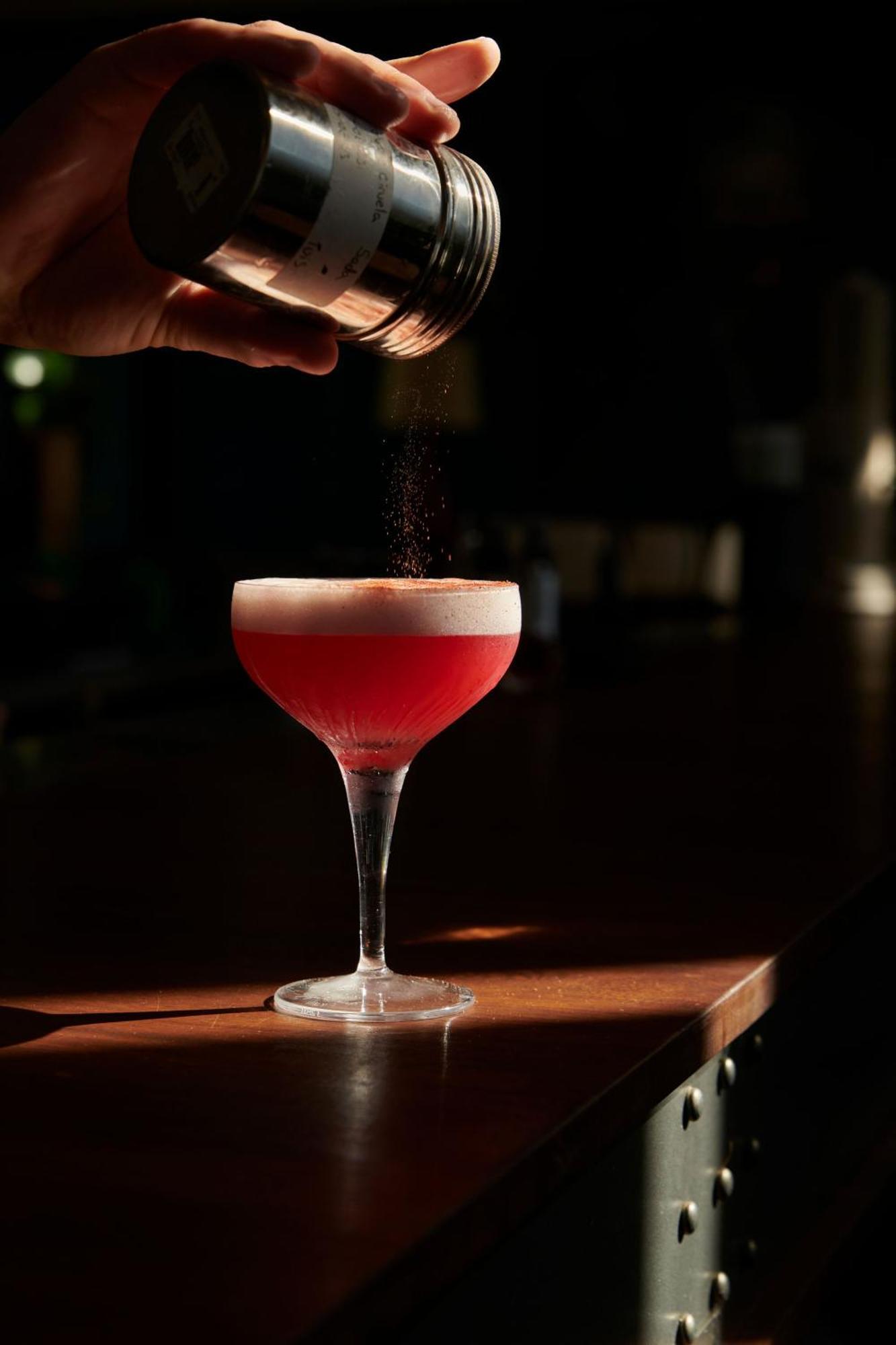The Click Clack Hotel Медельин Экстерьер фото A Clover Club cocktail being garnished with ground nutmeg